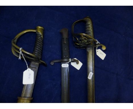 A British Cavalry sword, un-marked, one further cavalry officer's sword and a bayonet CONDITION REPORTS Sword without scabbar