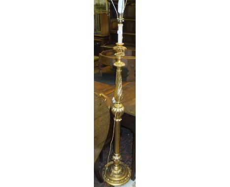 A gilt effect turned and carved lamp standard, together with a velvet covered standard lamp