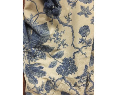 Two pairs of cotton lined curtains with printed blue and cream floral design and some spare material CONDITION REPORTS Approx