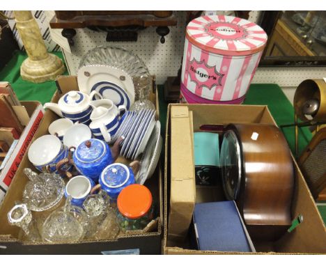 A box containing assorted china and glass ware to include an eggshell teaset, a box containing a mantel clock, a mid-20th Cen