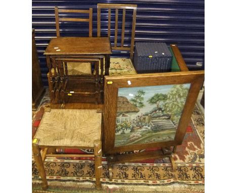 An oak nest of three tables, an oak drop leaf coffee table, a blue painted linen basket, a rush topped stool, a marble topped