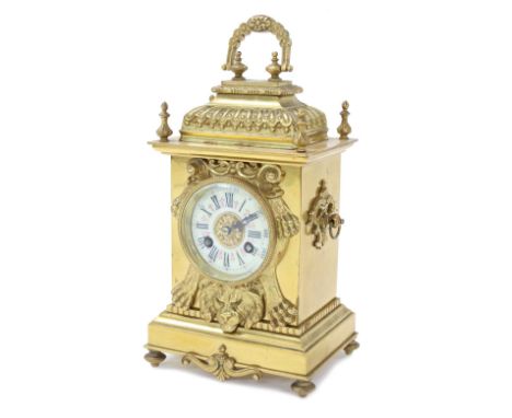 Small French brass two train mantel clock with platform escapement and striking on a gong, the 2.25" cream chapter ring withi