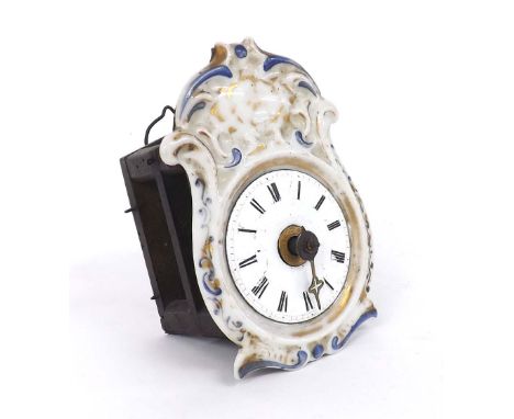 Miniature Black Forest clock timepiece, with white enamel dial within a porcelain foliate moulded and painted surround, 5" hi