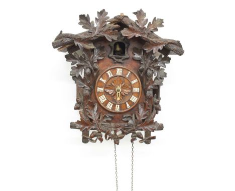Black Forest two train cuckoo wall clock in need of restoration, the 5" dial within a chalet case applied with vine leaves, 1
