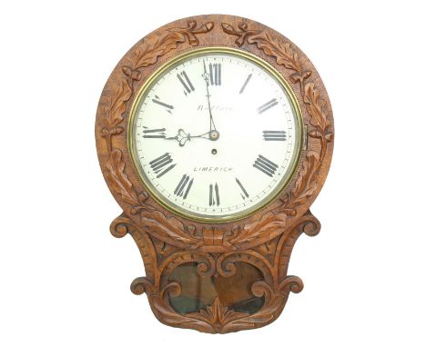 Irish single fusee oak 12" drop dial wall clock signed Wallace, Limerick, within a flat surround carved with oak leaves and a