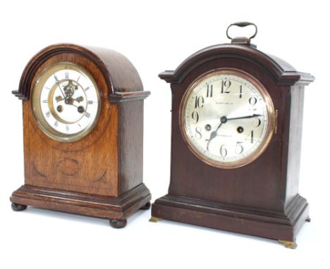 French oak two train mantel clock striking on a bell, the 4.5" white chapter ring enclosing a recessed visible escapement, wi