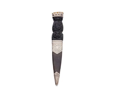  AN EDWARDIAN SGIAN DUBH MACDOUGALL (OF LONDON), EDINBURGH 1906 the carved Ebony handle with thistle decoration, the claw set