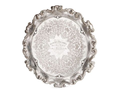 A VICTORIAN PRESENTATION SALVER RETAILED BY THOMAS SMITH & SONS OF EDINBURGH, SHEFFIELD 1895 of moulded circular form, ornat