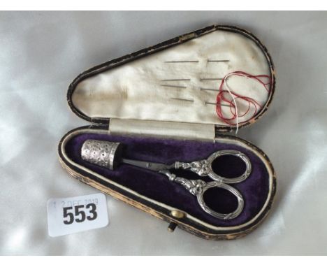 Cased silver  thimble and scissors     