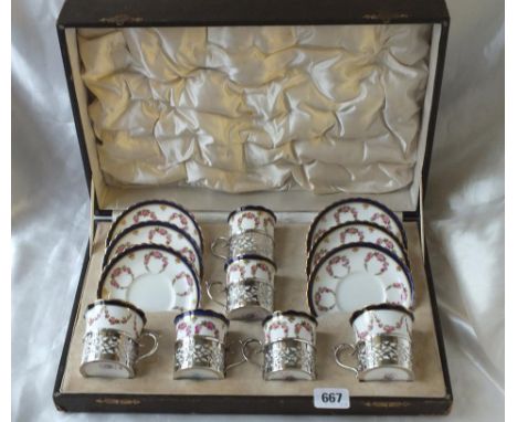 Boxed set of six cabinet cup and saucers with pierced sleeves, B'ham 1910 by Goldsmiths