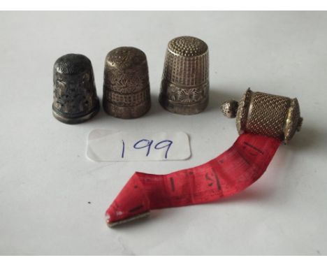 Two Charles Horner silver thimbles, another silver thimble  and an old seamstress measuring tape    