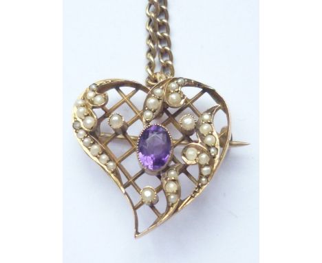 An antique amethyst and pearl openwork pendant brooch in the shape of a heart, the oval-cut amethyst of approximately .45ct, 