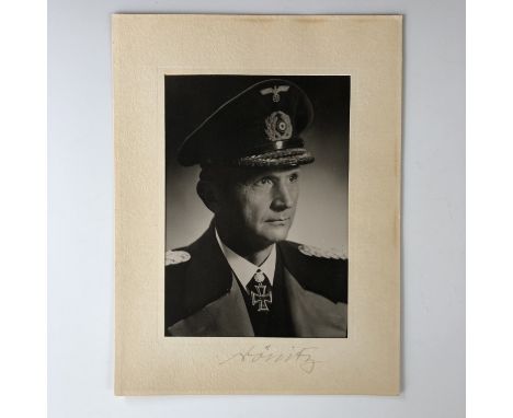 [Autographs] A photographic portrait of Admiral Karl Dönitz, in period card mount, the latter bearing the subject's signature