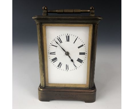 An early 20th century French brass cased carriage clock, having a Corniche case with engraved presentation 'LB from MP / June