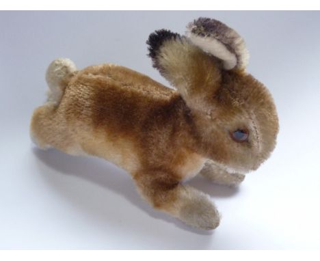 An early 20th Century Steiff miniature bunny, modelled in the act of running, 12 cm  