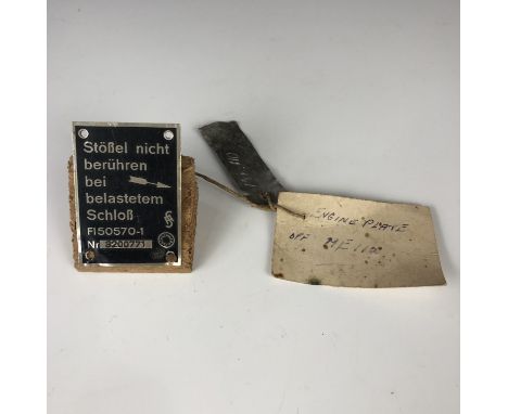 Two data plates recovered from Luftwaffe aircraft, one bearing a label with inscription "Engine plate off Me 110", the other 