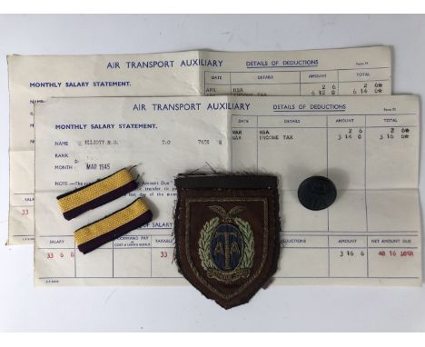 An Air Transport Auxiliary blazer badge, shoulder rank insignia, button and salary documents pertaining to ATA Flight Enginee