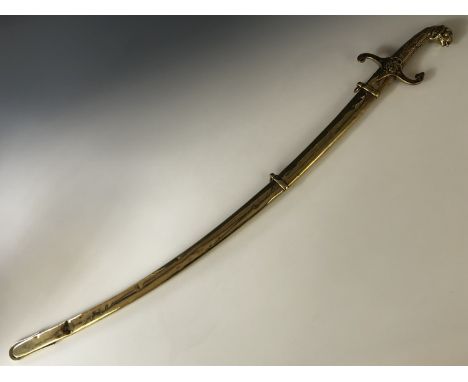 A 19th Century bandsman's sword, having a brass hilt with pommel modelled as a lion's head, slender curved blade and brass sc