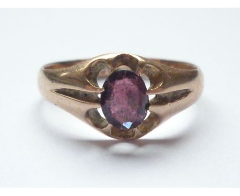 An antique 9ct gold and almandine garnet dress ring, the oval-cut and claw-set garnet of approximately .55ct, 2.3g 