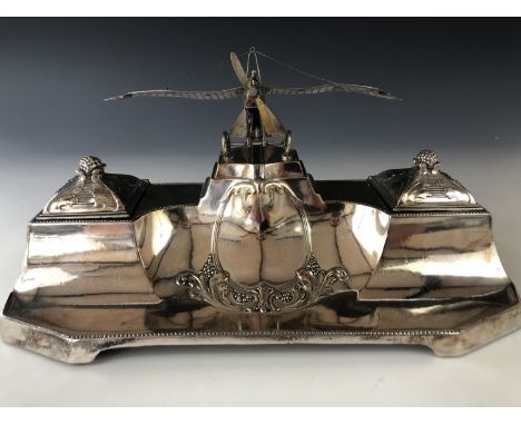 A Great War WMF electroplate in standish, surmounted by an accurate model of an Imperial German air force Rumpler Taube monop