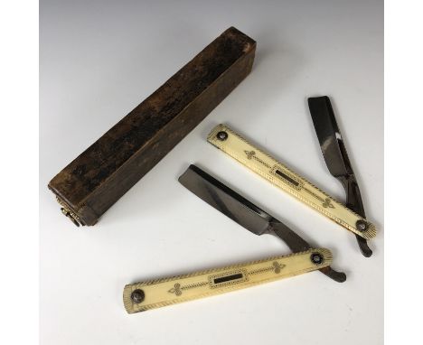 A cased pair of Regency cut-throat razors, by Priest, having pique worked ivory grip scales, each bearing an inset silver pla