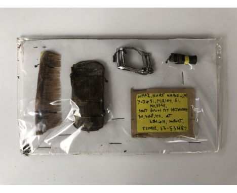 A small group of Battle of Britain Luftwaffe aircraft wreck-recovered artefacts bearing a label which reads Uffz Kurt Hubel (