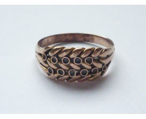 A vintage rose-yellow-metal dress ring, the herringbone face studded with two rows of small annuli, 3.3g