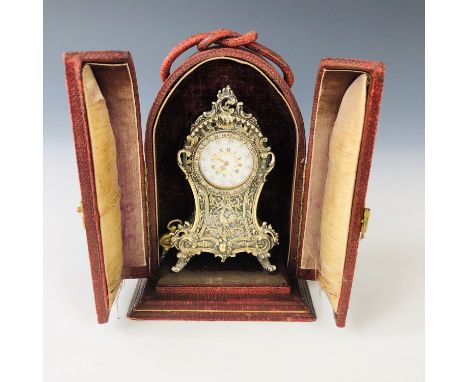A 19th century gilt white-metal and mother of pearl boudoir miniature clock, in the style of a Louis XV bracket clock, having