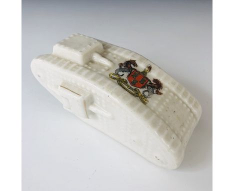 A Great War Arcadian crested china model of a tank, bearing the arms of the City of Newcastle on Tyne