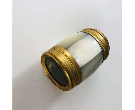 A lacquered brass, gilt-metal and mother-of-pearl spy glass, of barrel form, 7.5 cm extended