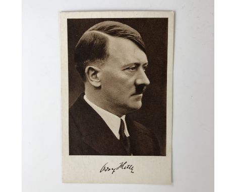 A studio photographic portrait of Adolf Hitler, offset lithographic print by Verlag Heinrich Hoffmann, Munchen, facsimile sig