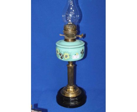 BRASS AND PAINTED GLASS COLUMN OIL LAMP
reservoir in teal glass painted with floral decoration, with glass chimney, 62cm high