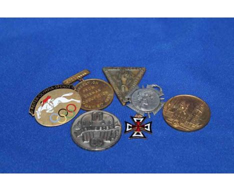 LOT OF GERMAN WWII MEDALS AND BADGES
including a German Equestrian Olympic Donation 1936 enamel oval gilded badge with jumpin