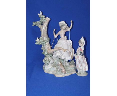 LARGE LLADRO FIGURE OF A GIRL SWINGING FROM A TREE
broken; together with a Lladro figure of a Spanish girl in traditional dre