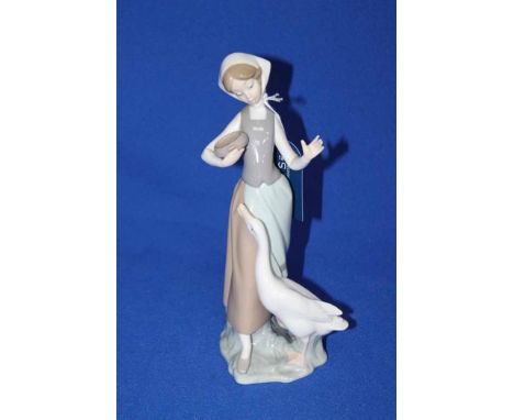 LLADRO FIGURE OF A YOUNG GIRL
carrying a pot with a goose, 24cm high