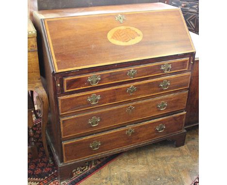 An Edwardian inlaid mahogany bureau, with fall enclosing a fitted interior, over four graduated long drawers, on bracket feet