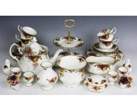 A Royal Albert Old Country Roses tea service comprising; a teapot and cover, six teacups and saucers and stands, six plates, 