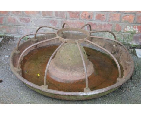 A late 19th century cast iron circular pig trough, 87cm diam