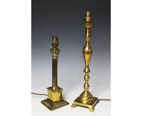 An early 20th century brass standard lamp, with turned column upon circular base raised by three paw feet, 110cm high, along 