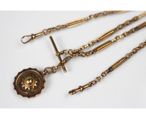 A 9ct yellow gold decorative watch albert, the fancy link chain with central T bar and circular fob, gross weight 16.1gms    