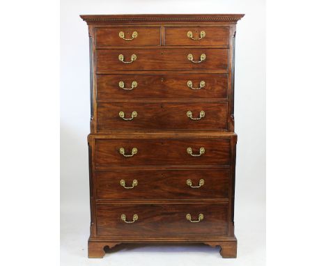 A George III mahogany chest on chest, with dentil cornice above two short and three graduated long drawers, over three furthe