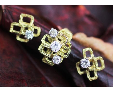 A 1970's diamond set ring and matching earrings, each designed in abstract form as overlapping squares in yellow gold and set