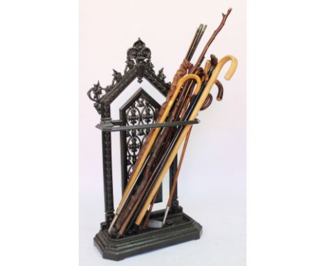 A 19th century cast iron stick stand, possibly Coalbrookdale, of arched form and with foliate detailing, on canted base, 101c
