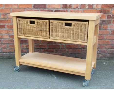 A modern beech kitchen inland, with two basket drawers above a pot shelf