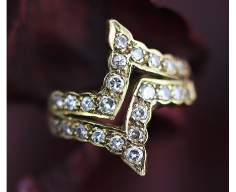 A diamond set dress ring, London 1978, the 18ct yellow gold and diamond ring of abstract 'zig zag' design, size M/N weight 6.