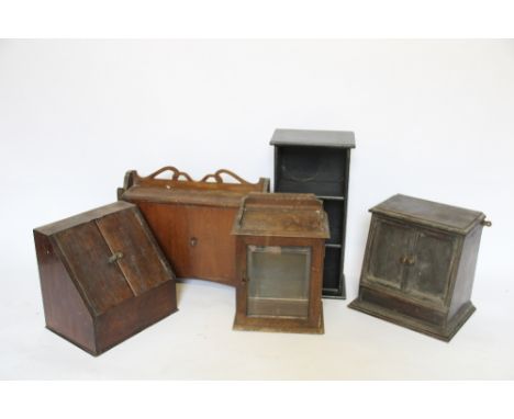 An Edwardian oak smokers cabinet, with glazed door, 36cm H, with three other two door cabinets and a small shelf unit (5)