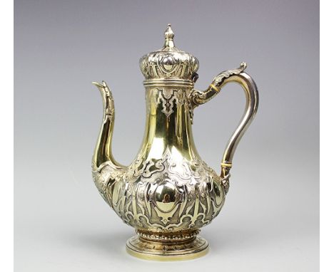 A Victorian silver gilt coffee pot Hunt and Roskell, Late Storr, Mortimer and Hunt, London 1850, with elaborate gothic strap-