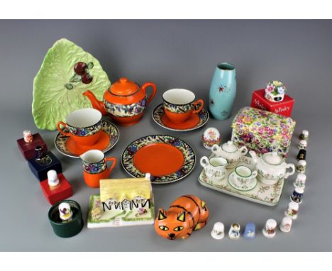 A collection of assorted collectable ceramics to include a Lorna Bailey model cat, a British Anchor Pottery tete a tete part 