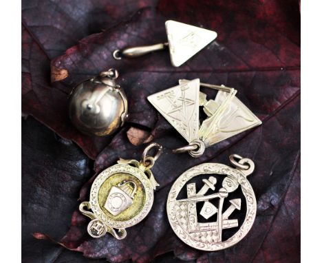 A collection of assorted Masonic fobs and pendants, to include; three 9ct gold fobs including a fan example, along with a '58