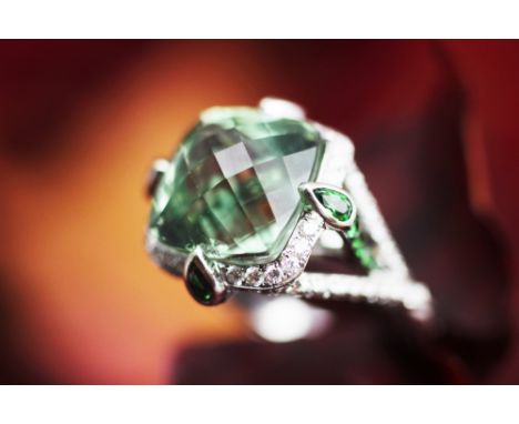 A Stephen Webster green amethyst and diamond set dress ring, designed as a central mixed cut green amethyst within an intrica